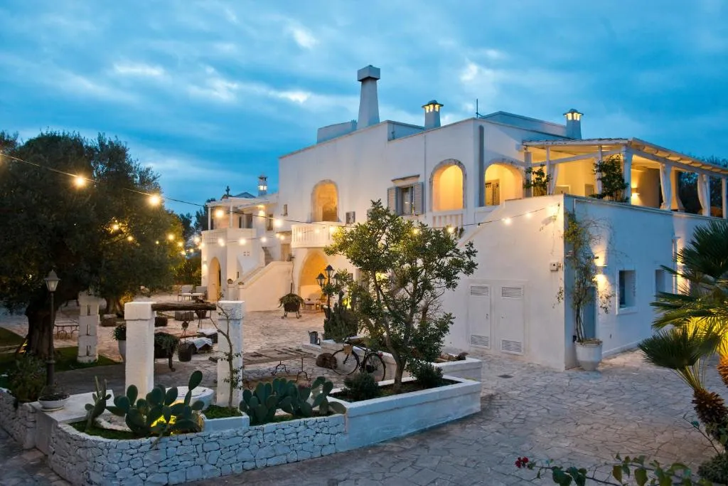 Masseria Salinola — masseria outdoor pool surrounded by olive groves in Ostuni, Puglia